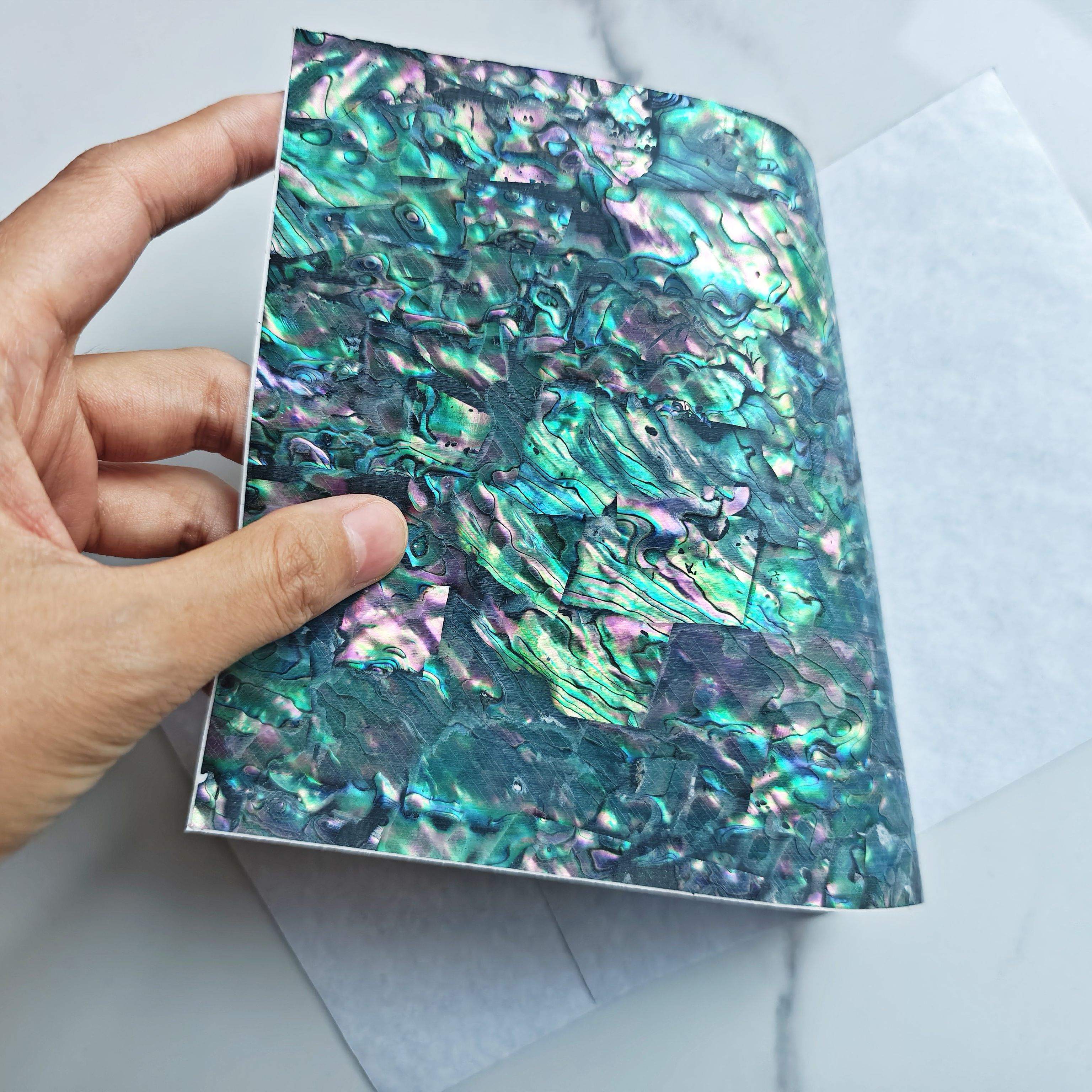 Natural flexible abalone with adhesive shell sheet