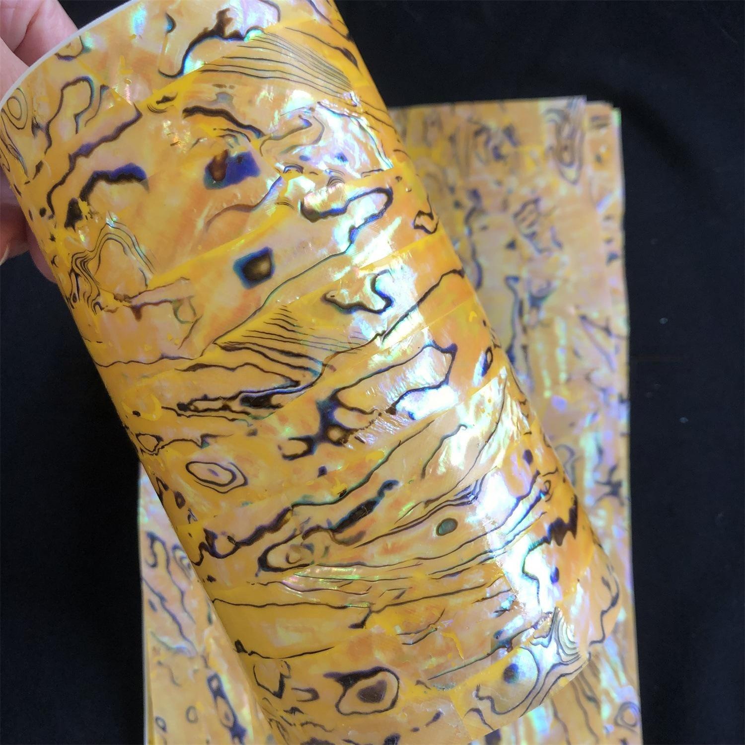 Natural flexible abalone with adhesive shell sheet